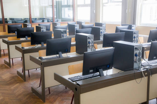 Computer classroom classroom it classroom empty education desk stock pictures, royalty-free photos & images