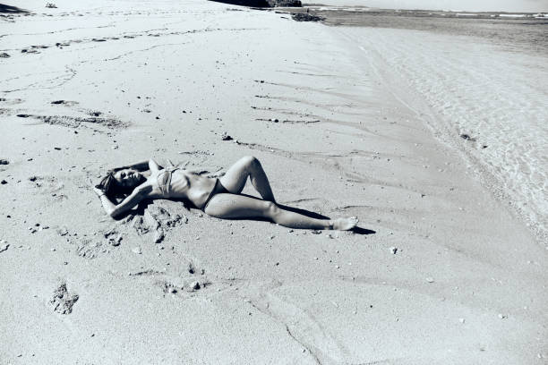 istock Slim woman enjoying on a sandy tropical beach. 1091695282
