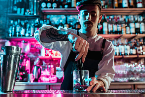 istock Expert barman is making cocktail at night club. 1091695342