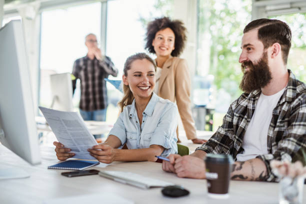 istock Happy start up team working at corporate office. 1091695626