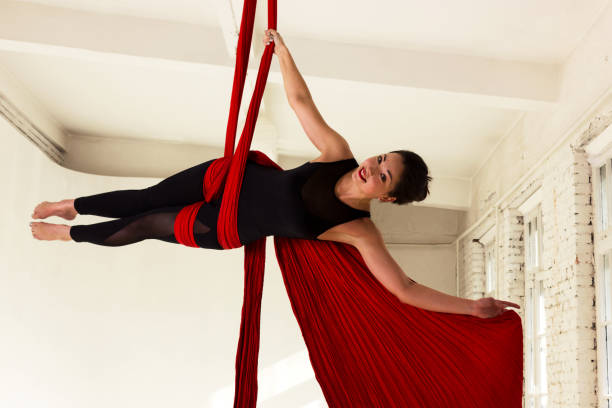 istock Girl training on aerial silks 1091697468