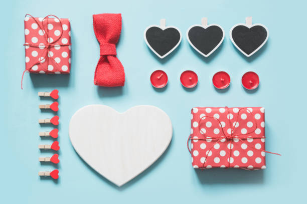 istock Valentine's day card. Set of gift, red hearts on blue surface. Top view. Copy space. 1091698124