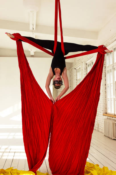 istock Girl training on aerial silks 1091701156