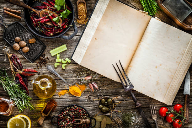 istock Spices and herbs with a cookbookshot from above on rustic wooden table 1091701688