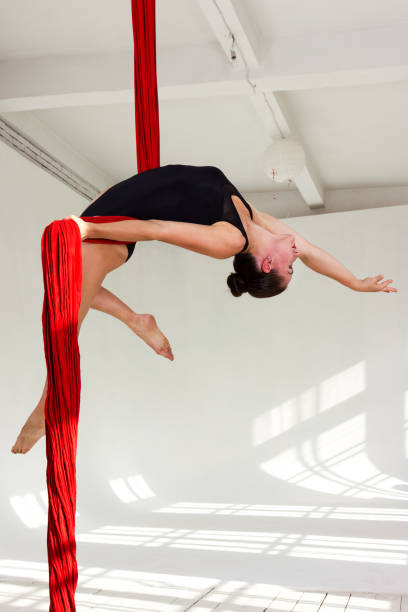 istock Girl training on aerial silks 1091702212