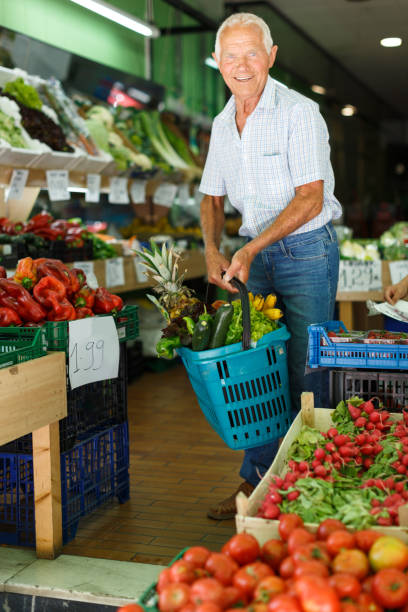 istock Senior man with basket with fresh greengrocery 1091706142