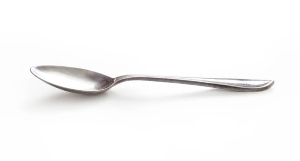 istock old silver spoon isolated on white with clipping path included 1091706464
