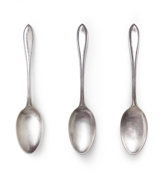 old silver spoon isolated on white with clipping path included old silver spoon with different light isolated on white background with clipping path included, high angle view teaspoon stock pictures, royalty-free photos & images