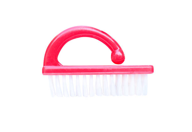 istock Red plastic nail brush with white bristles isolated on white background with clipping path 1091708000
