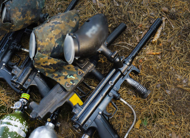 istock Paintball. Charge the weapon. Helmet for paintball 1091709706