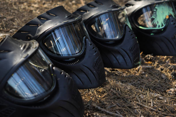 istock Paintball. Charge the weapon. Helmet for paintball 1091709748