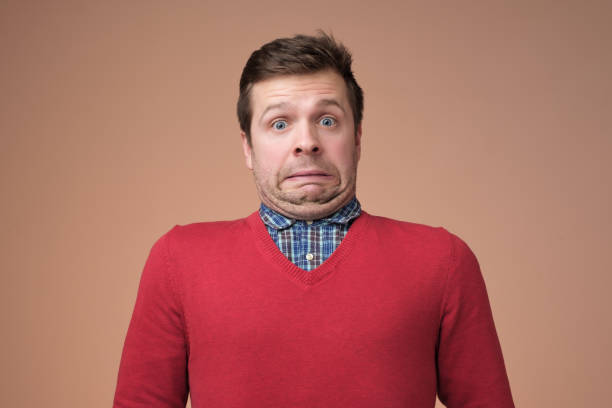 istock Funny caucasian man grimacing guilty face at studio background 1091713096