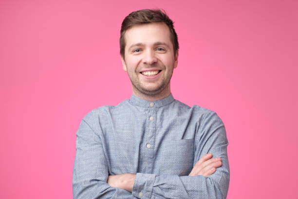 istock Smiling positive caucasian man in blue shirt 1091713524