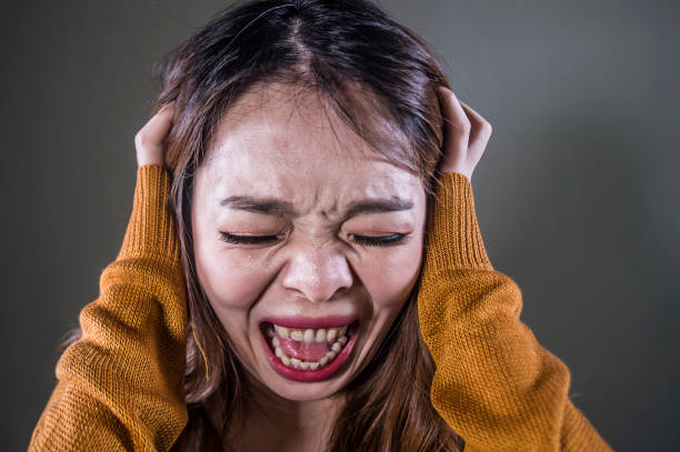 istock young upset Asian Korean woman screaming scared 1091716648