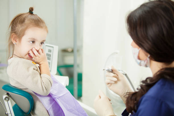 istock Child refuses to go through medical procedure in dentist office 1091717742