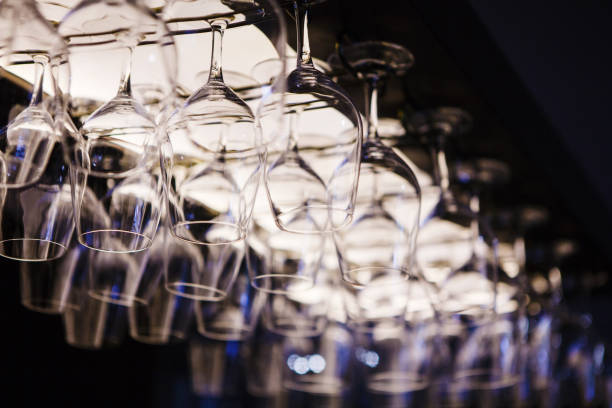 istock Empty wine glasses hanging upsidedown in bar interior. 1091720332