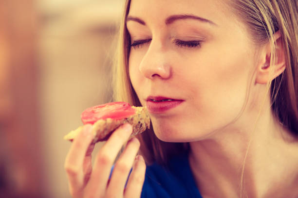 istock Woman having healthy breakfast eating sandwich 1091720646