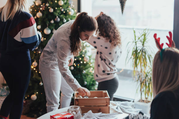 istock Cute girls decorating Christmas tree 1091724184