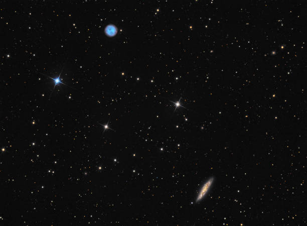 istock Planetary nebula M97 (Owl) and galaxy M108 in constellation Ursa Major 1091727750