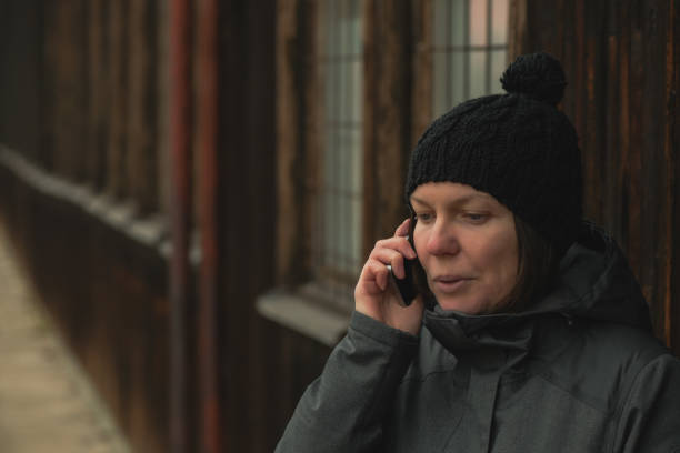 istock Worried woman talking on mobile phone 1091732910