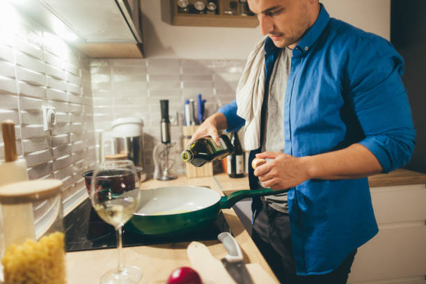istock Young man preparing delicious dish in his kitchen 1091735576