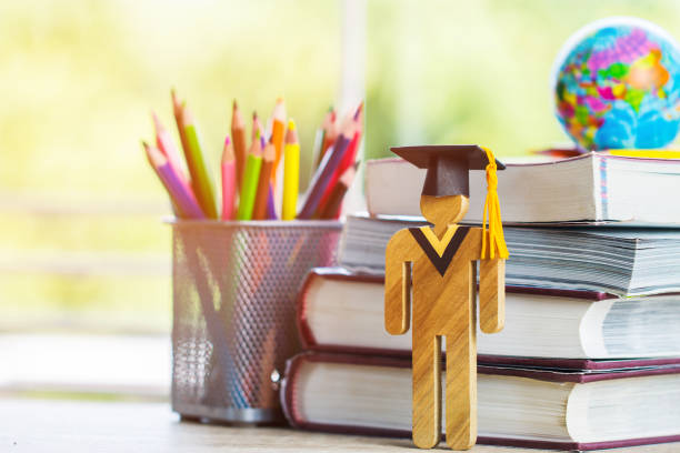 istock Europe Education knowledge learning study abroad international Ideas. Student Sign wood with Graduation celebrating cap on stack textbook with model global map, alternative studyingorld wide 1091737154