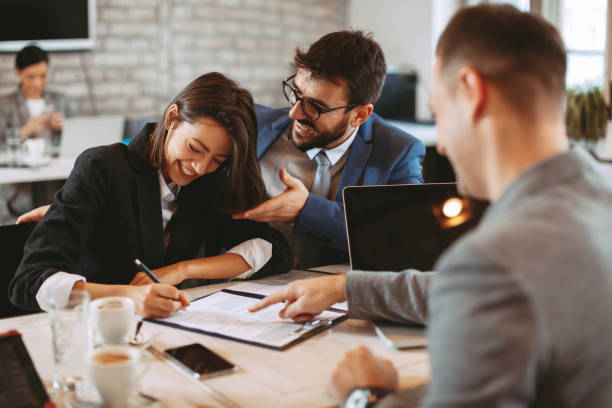 istock Young business couple signing a contract 1091740302