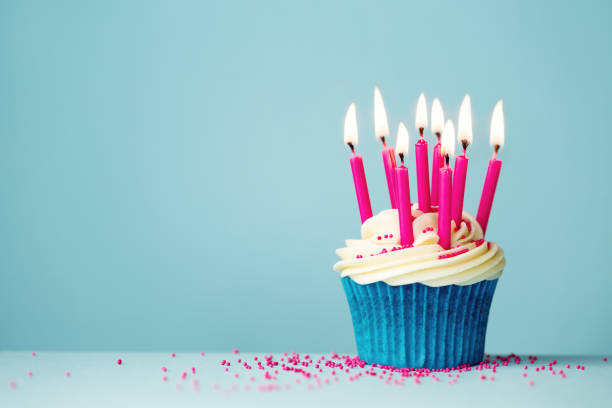 istock Birthday cupcake with pink candles 1091740814