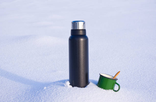 istock Thermos and mug in the snow 1091741038