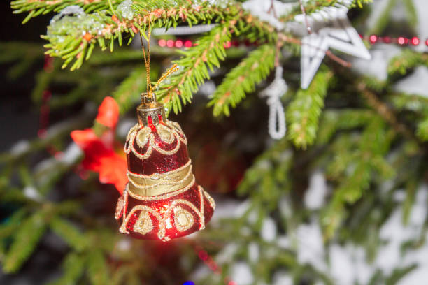 istock Christmas tree toy weighs on the tree at night in winter 1091743358