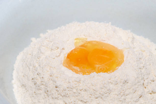 istock The egg is divided into white flour in the bowl 1091743402