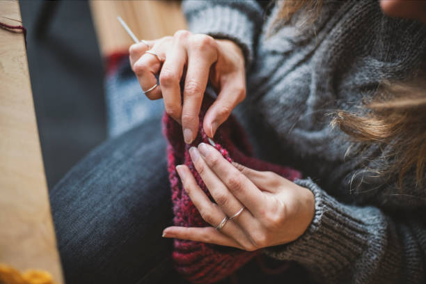 istock Close up on woman's hands knitting 1091743684