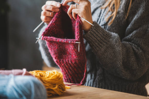 istock Close up on woman's hands knitting 1091743688