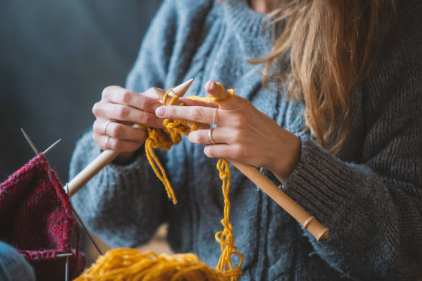 istock Close up on woman's hands knitting 1091743690