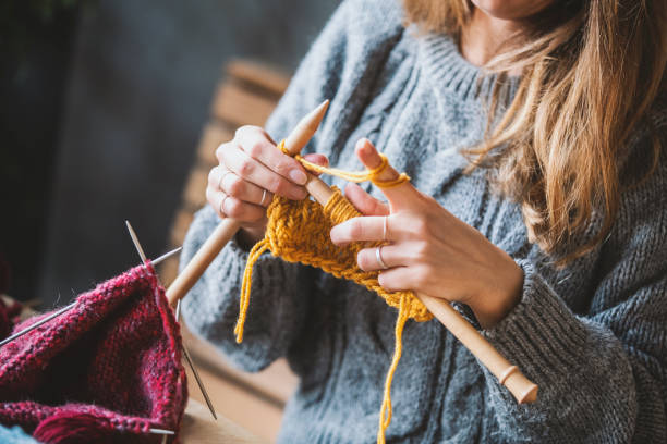 istock Close up on woman's hands knitting 1091743692