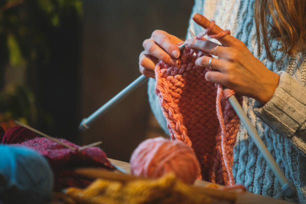 istock Close up on woman's hands knitting 1091743698