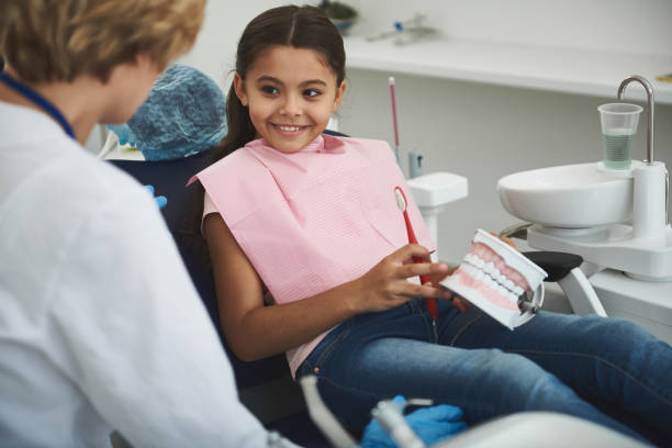 istock Joyful smiling girl visiting her professional dentist 1091745814