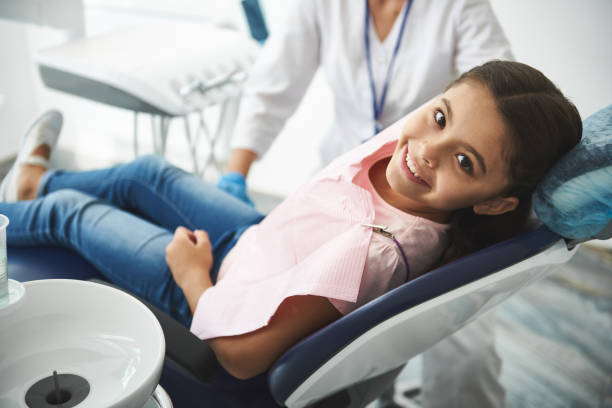 Overjoyed nice girl visiting her professional dentist