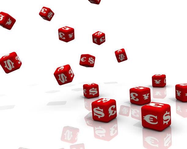 istock Red cubes labeled with currency symbols falling on a white surface 1091747194