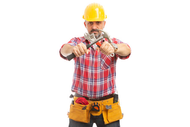 istock Constructor holding crossed hammer and wrench 1091748534