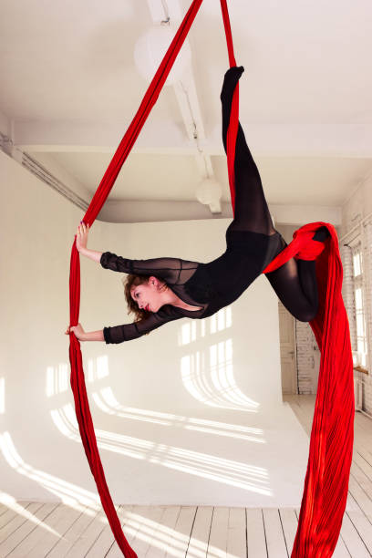 istock Girl training on aerial silks 1091748698