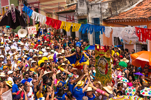 Olinda, Pernambuco, Brazil - February 12, 2018: Brazilians and tourists wearing costumes and celebrate the Carnival 2018 in Olinda, Pernambuco, Brazil