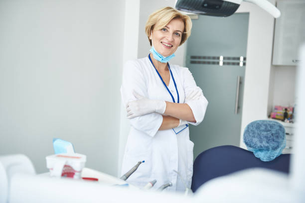 istock Happy adult dentist is enjoying working time 1091756408