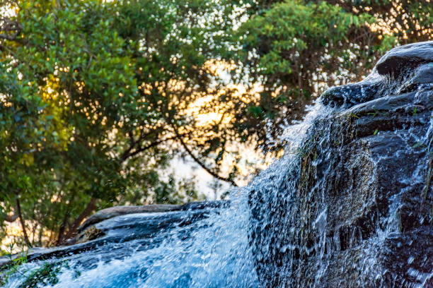 istock Small waterfall detail with water running over rocks 1091758402