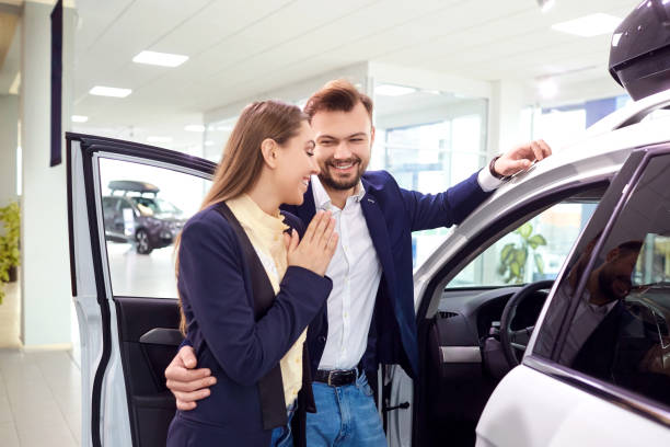 istock A young couple chooses a car and auto salon 1091760090