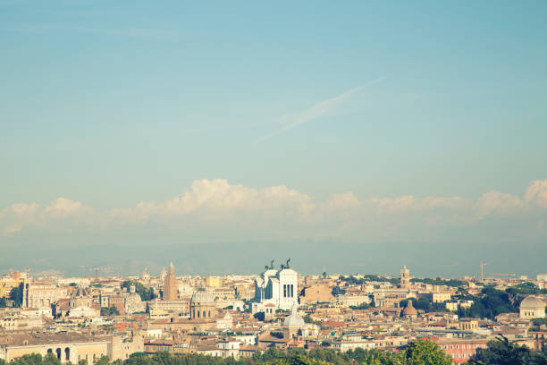 Panoramic view over Rome bathing in autumn sun seen from the Janiculum hill west of the city. With landmarks as the Pantheon and the Vittorio Emanuele II monument.