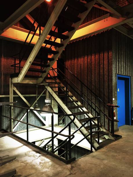 Stairs inside a dirty old industrial plant.