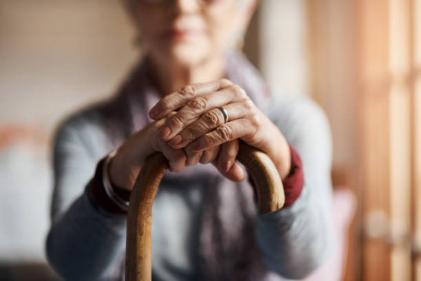 I get by with a little help from my cane Cropped shot of a senior woman holding a cane in a retirement home nursing home stock pictures, royalty-free photos & images
