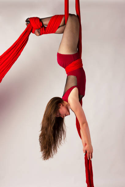 istock Girl training on aerial silks 1091764806