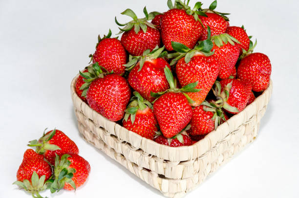 istock red strawberry in wicker bowl 1091766048